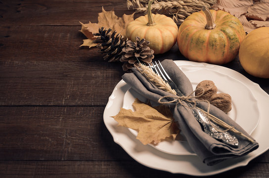 Autumn table setting, selective focus, copy space, toned image