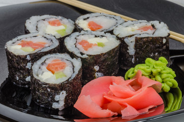 Japanese sushi made with rice, fish and seaweed with ginger and wasabi