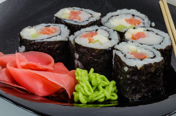 Japanese sushi made with rice, fish and seaweed with ginger and wasabi