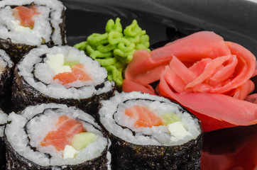 Japanese sushi made with rice, fish and seaweed with ginger and wasabi