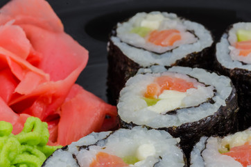 Japanese sushi made with rice, fish and seaweed with ginger and wasabi