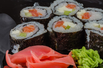 Japanese sushi made with rice, fish and seaweed with ginger and wasabi