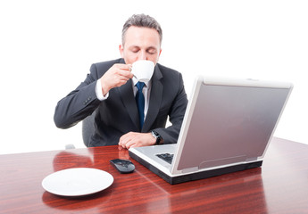 Handsome manager drinking fresh coffee