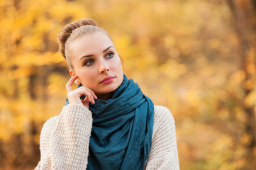 Beautiful young female standing outside