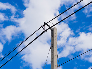 electric pole power lines and wires with blue sky. in Thailand.
