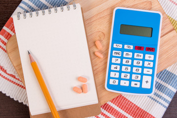 Calculate calories to lose weight. Calorie counting on a paper. (Diet concept)