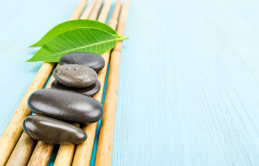 Spa stone on light blue background