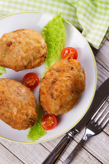Scotch Eggs Served with Tomato Cherry and Salad on White Plate