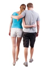 Back view of going young couple (man and woman). walking beautiful friendly girl and guy in shorts together. Rear view people collection. backside view of person.  Isolated over white background