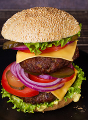 Delicious Burger With Beef, Tomato, Cheese, Lettuce and Onion