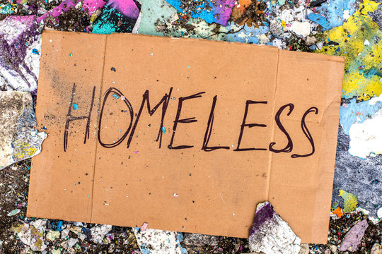Sign of homeless man on cardboard