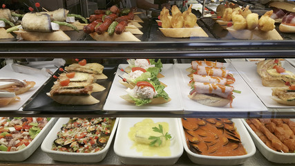 Tapas in the restaurant, Spanish typical food in Benidorm, Alicante, Spain.