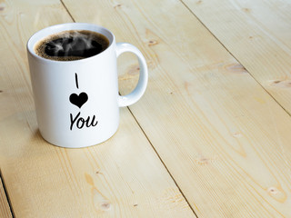 I love you on mug or coffee cup on wood table - Powered by Adobe