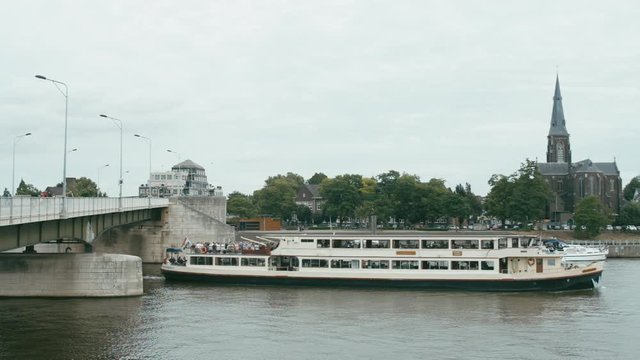 WIDE FIXED Long passenger ship on a lake Meuse, Maastricht, Netherlands. 4K UHD