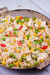 Chicken Breasts with Rice, Peas, Corn and Chili. View from above, top studio shot