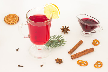 A glass of mulled wine and a slice of lemon, star anise  