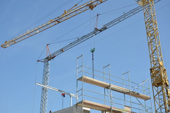 Scaffolding and cranes on construction site