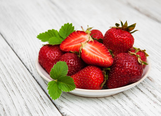 ripe strawberries on wooden table