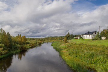 scenic river and house in finland