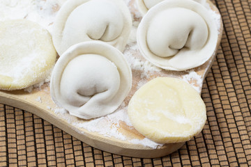 Raw dumplings on the board