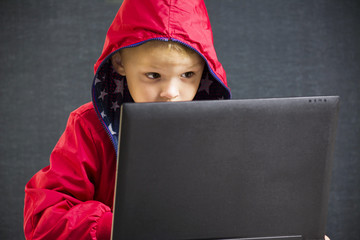 boy playing laptop