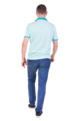 Fototapeta premium Back view of going handsome man in jeans and a shirt. walking young guy . Rear view people collection. backside view of person. Isolated over white background.