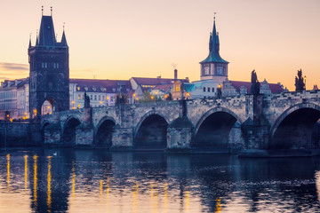 Obraz na płótnie Canvas Prague city sunrise over Charles Bridge on Vltava river