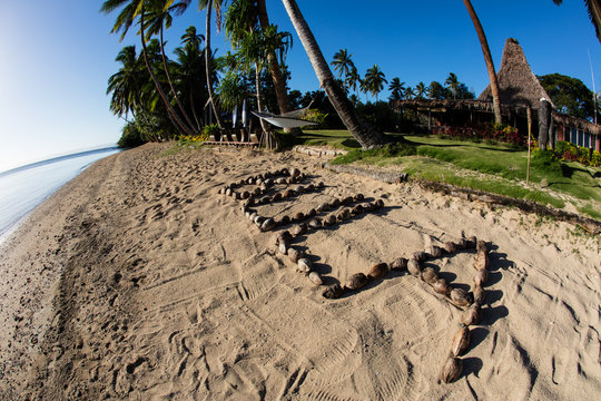 Coconuts Spelling "Bula" on Beach