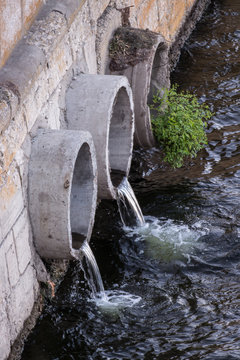 pipes pouring water in the river