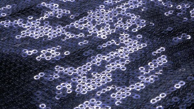 Sparkling blue shiny cloth pattern close-up details 4K 2160p 30fps UltraHD tilting footage - Sequins on blue fabric texture fashion and luxury background slow tilt 4K 3840X2160 UHD video 