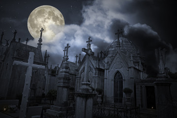 Old cemetery in a full moon night