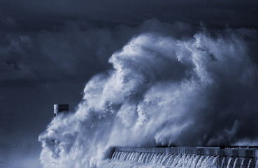 Beacon and pier under heavy storm
