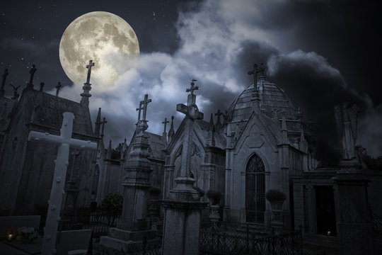 Old cemetery in a full moon night