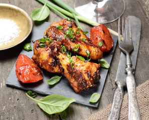 fried chicken wings on a wooden background