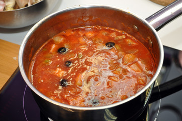 tomato soup with olive in a pot