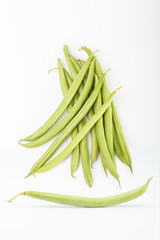 green vegetable beans on a white background. raw vegetable.