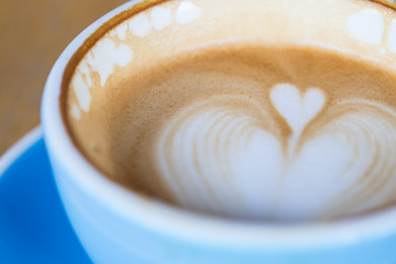 hot coffee with heart shape latte art, background concept