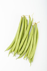 green beans on a white background. color image of green vegetables side view