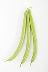 green beans on a white background. color image of green vegetables side view