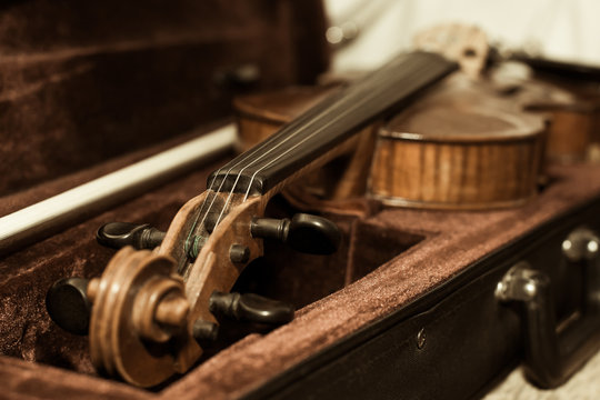  Fragment of a violin close-up lying in its case