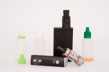 group of electronic cigarette and liquid nicotine on white background