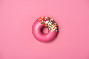 Donuts with icing on pastel pink background. Sweet donuts. - obrazy, fototapety, plakaty