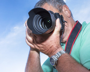 Photographer with a camera when photographing