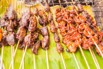 Marinated grilled chicken for sale at local Thai market
