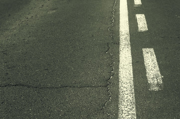 Fototapeta premium Double white line on asphalt road.