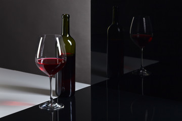  bottle and glass with red wine