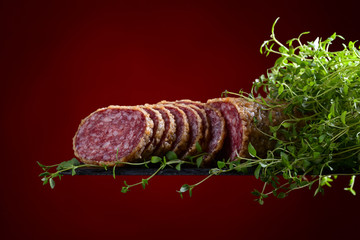 sliced salami with thyme