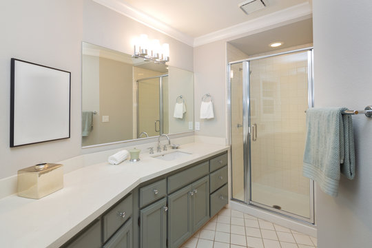 Modern bathroom with full bath shower, and tile floor, also incl