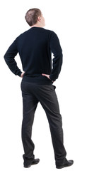 back view of Business man  looks ahead. Young guy in sweater watching.  Rear view people collection.  backside view of person.  Isolated over white background.