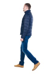 Naklejka premium Back view of going handsome man in jeans and jacket. walking young guy . Rear view people collection. backside view of person. Isolated over white background.